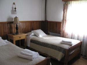 Rúm í herbergi á Hotel Mi Casa