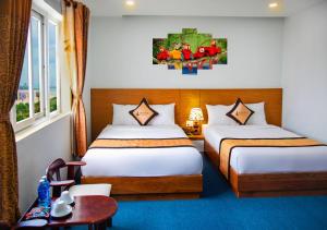 Katil atau katil-katil dalam bilik di Legacy Hotel