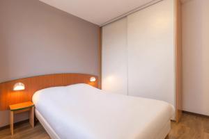 En eller flere senger på et rom på City Residence Access Strasbourg