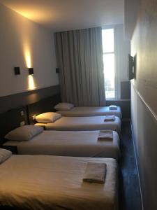 Postel nebo postele na pokoji v ubytování Hotel Manofa