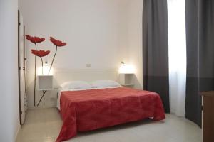 A bed or beds in a room at Residence Villa Ofelia