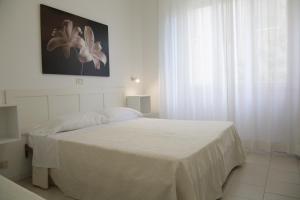 A bed or beds in a room at Residence Villa Ofelia