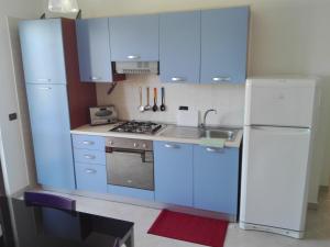 Kuchyňa alebo kuchynka v ubytovaní GoodStay Casa Tati