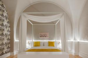 Posteľ alebo postele v izbe v ubytovaní Quattro Canti Suites
