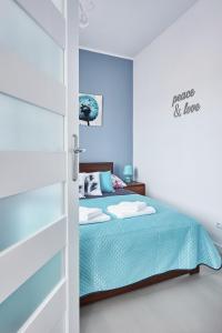 Postel nebo postele na pokoji v ubytování Apartament Zdrojowy