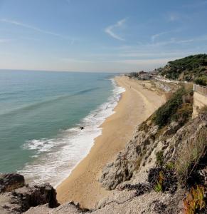 a view of the beach from a cliff at L'Hostalet d'Arenys de Mar in Arenys de Mar