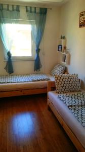Postel nebo postele na pokoji v ubytování Barbi Apartman KRK