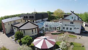 an overhead view of a building with an umbrella at Hotel Monika in Büttelborn