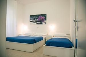 A bed or beds in a room at Residence Villa Ofelia