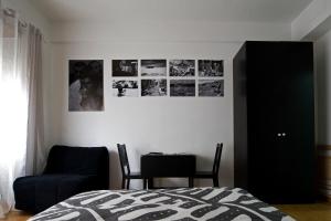A bed or beds in a room at The Photos Room B&B Még 10 kép
