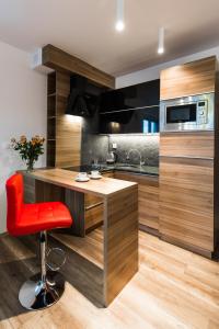 Kuchyňa alebo kuchynka v ubytovaní APARTAMENTY GORZÓW WLKP.