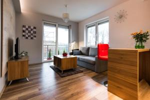 Televízia a/alebo spoločenská miestnosť v ubytovaní APARTAMENTY GORZÓW WLKP.