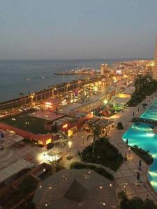 a night view of a resort with a swimming pool at Penthouse Three-Bedroom Villa in Porto Sokhna Family only in Ain Sokhna