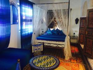 A bed or beds in a room at Dar Hafsa