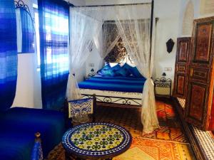 A bed or beds in a room at Dar Hafsa