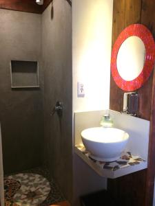 a bathroom with a sink and a mirror at B&B Oui Madame in Tijuana