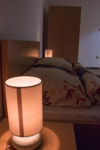 A bed or beds in a room at Sasfészek - Falusi szálláshely 