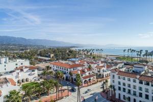 an aerial view of a city with palm trees and the ocean at Hotel Californian in Santa Barbara