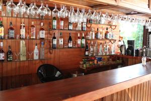 a bar with many bottles of alcohol on the wall at Veranda Hotel in Bozburun