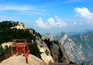 a building on the side of a mountain at Huashan International Youth Hostel in Huayin