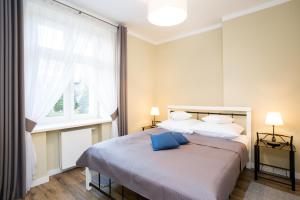Postel nebo postele na pokoji v ubytování Apartamenty Bystra