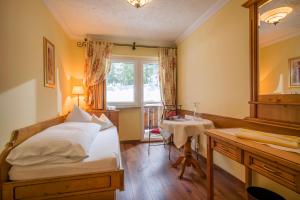 Łóżko lub łóżka w pokoju w obiekcie Das Rotspitz Adults - only