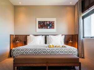 Postel nebo postele na pokoji v ubytování Hotel de Guimaraes Business & SPA