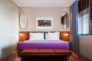 Postel nebo postele na pokoji v ubytování Hotel de Guimaraes Business & SPA