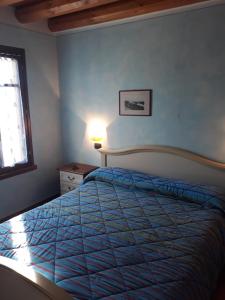 Postel nebo postele na pokoji v ubytování Agriturismo Trebis