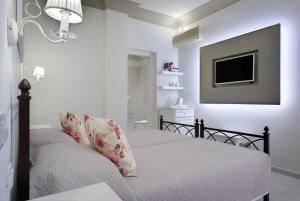 Postel nebo postele na pokoji v ubytování Zephyros Hotel