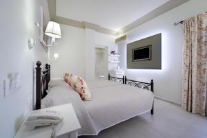Postel nebo postele na pokoji v ubytování Zephyros Hotel