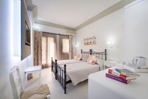 Postel nebo postele na pokoji v ubytování Zephyros Hotel