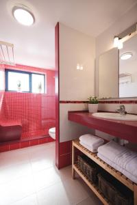 a bathroom with a sink and a red shower at Cardon Big Calm 12 in Costa Calma