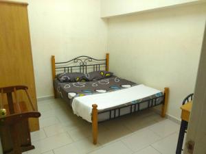a bedroom with a bed in a room at Ocean view resort in Port Dickson