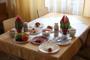 a table with plates of food on top of it at Saint Ignatius Retreat House in Ljubljana