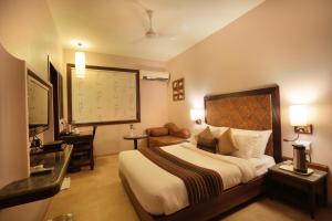 Säng eller sängar i ett rum på Abbott Hotel
