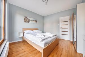 Posteľ alebo postele v izbe v ubytovaní Apartamenty Sun & Snow Gdańsk Bursztynowa