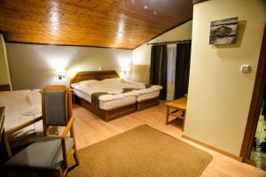 a small room with a bed and a room with at Naoussa Mountain Resort in Agios Pavlos +56 photos