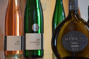 two bottles of wine sitting next to each other at Gästezimmer Fuchs in Ramsthal