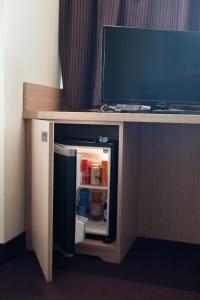 
A television and/or entertainment center at Hotel Capital
