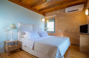 Postel nebo postele na pokoji v ubytování Olea Prime + 21 fotografií