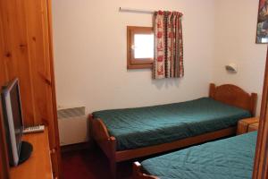 Postel nebo postele na pokoji v ubytování Orsière Appartements VTI