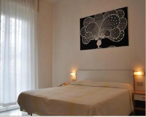 Postel nebo postele na pokoji v ubytování Hotel Villa Cavalli