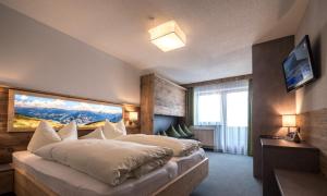 Postel nebo postele na pokoji v ubytování Central Hotel & Apart mit Landhaus Central
