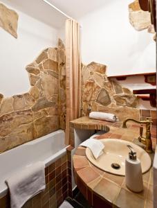 a bathroom with a sink and a bath tub at Green Apartment in Budapest