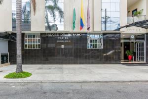 a building with flags on the side of it at Hotel Sauces del Estadio in Medellín