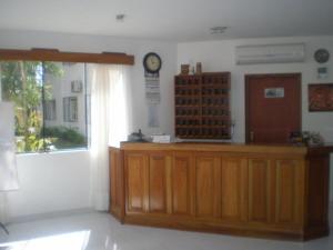 a court room with a clock on the wall at Ruta Del Sol in Ypacarai