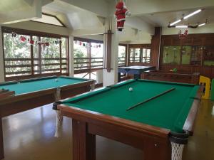 a billiard room with two pool tables in it at Residencial Pousada do Serrano in Gramado