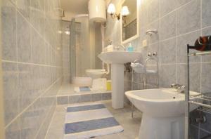 a bathroom with a sink and a toilet at Villa Augusta Ferri in Rovinj +25 photos
