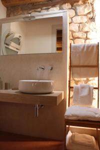 a bathroom with a sink and a mirror at Corte Tre Vigne in Marano di Valpolicella